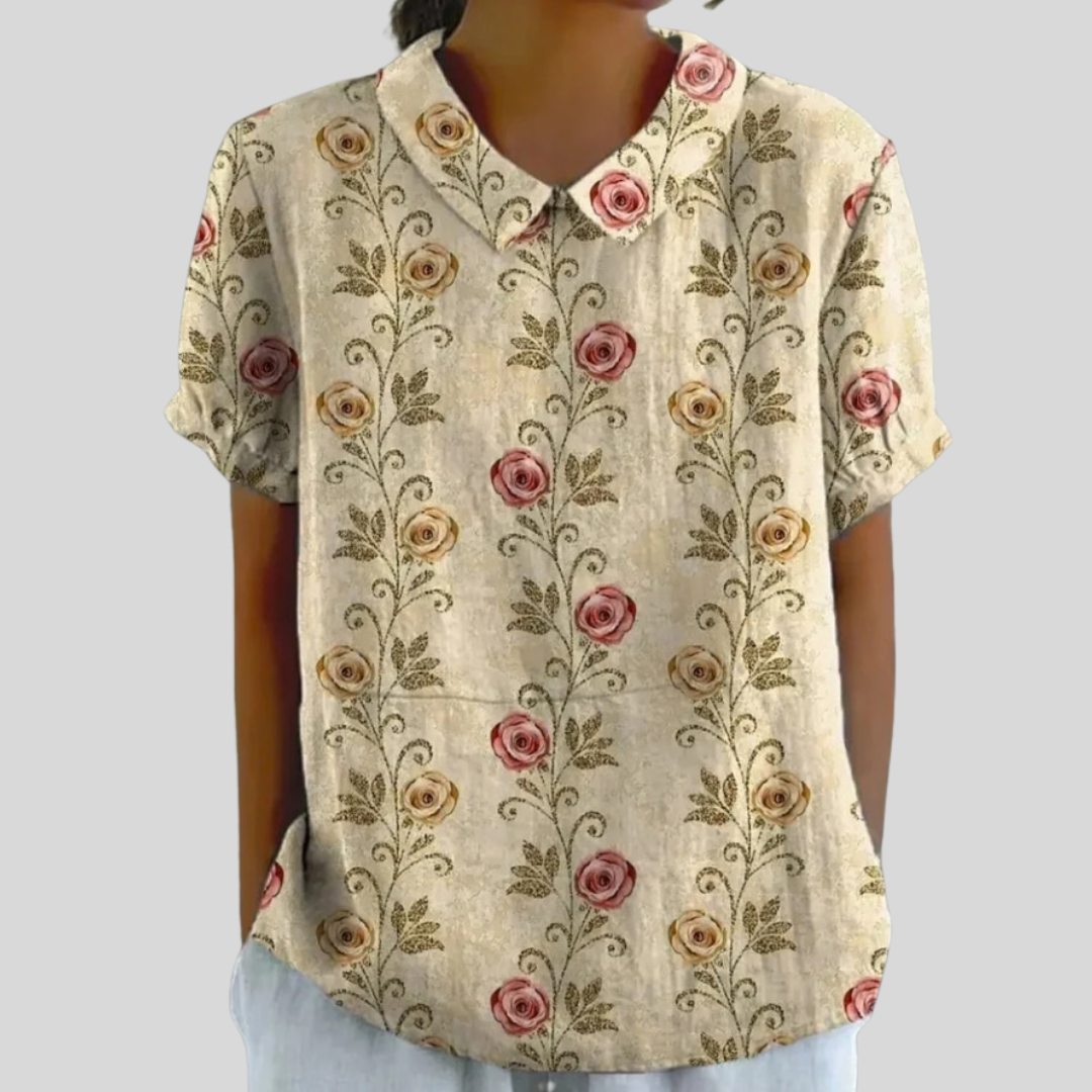 Blouse Amélie Danoir Paris avec motif roses classiques, manches longues et col en V, tissu léger et élégant.