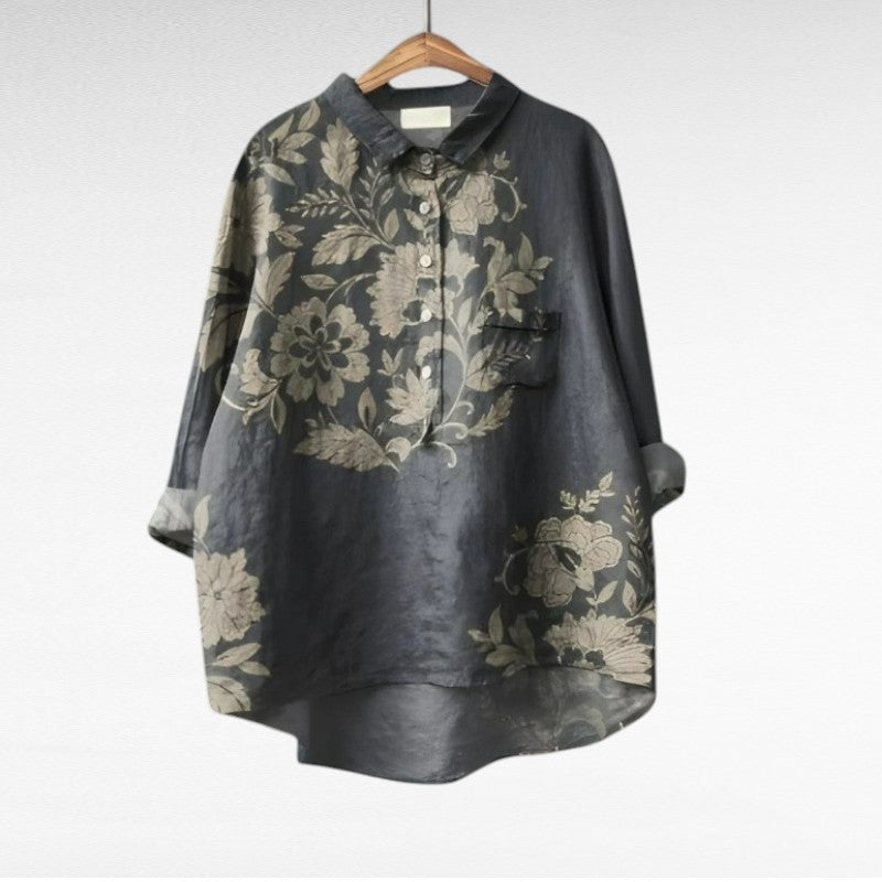 Blouse printanière élégante Geneviève de Danoir Paris, tissu léger avec motifs floraux, col droit et manches longues.