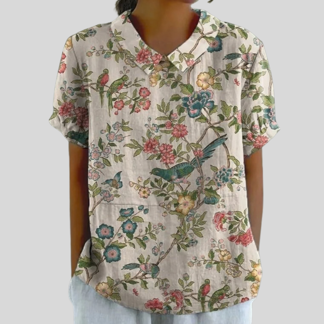 Blouse florale illustrée Joséphine de Danoir Paris, en tissu léger, avec motifs floraux colorés et manches longues élégantes.