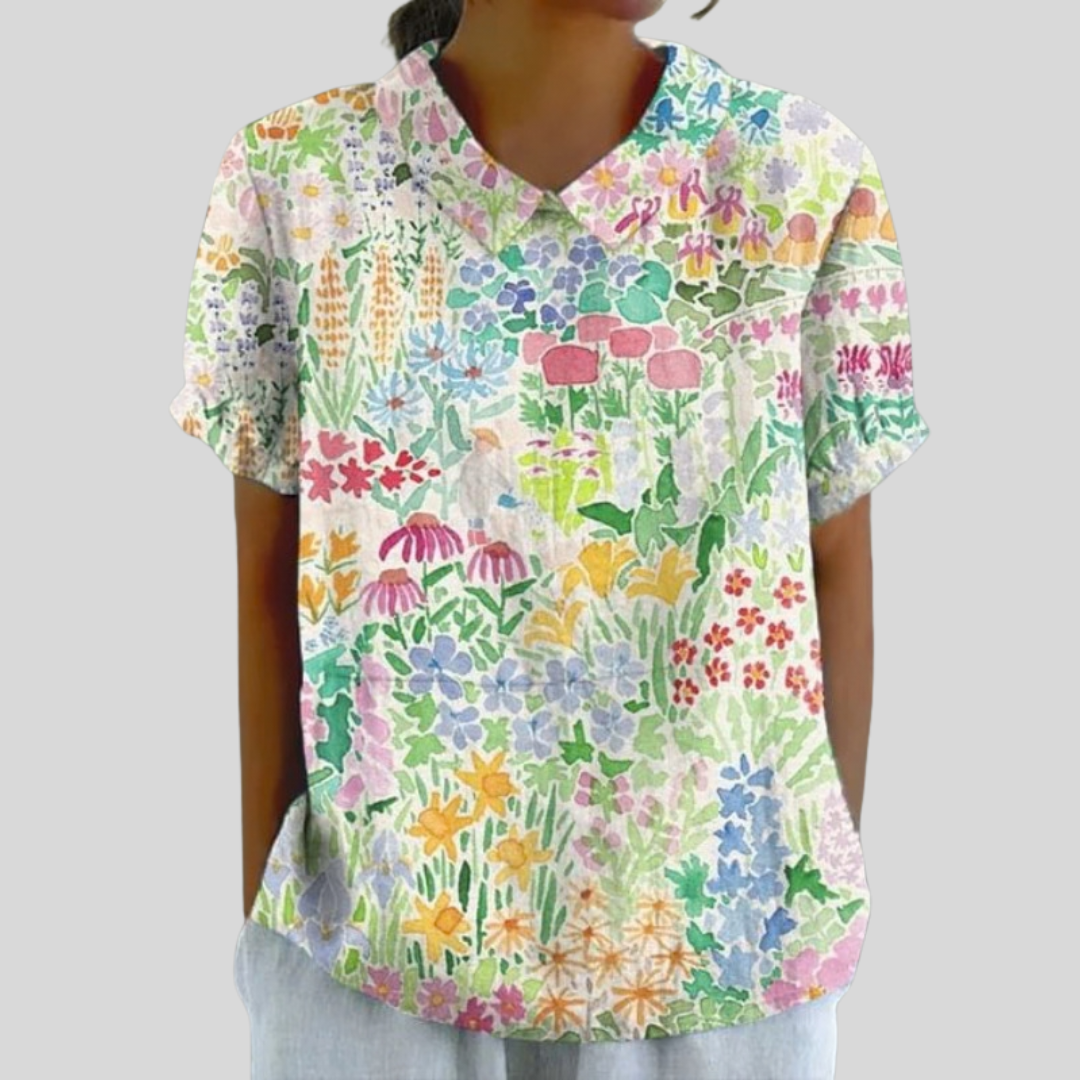 Blouse Jardin Coloré Solène par Danoir Paris, tissu léger avec motifs floraux colorés, manches longues et col en V.