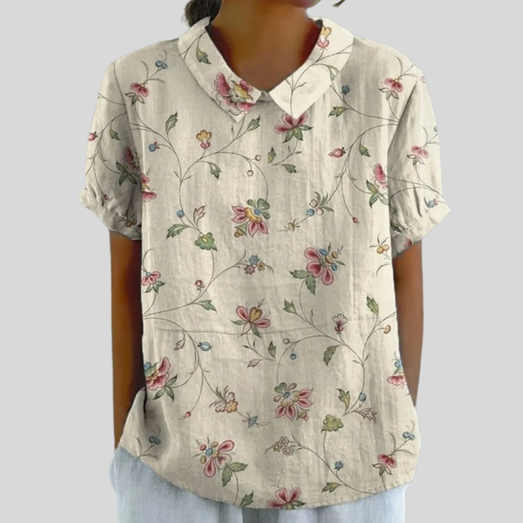 Blouse florale délicate Thérèse de Danoir Paris, tissu léger avec motifs floraux, manches longues et coupe élégante.