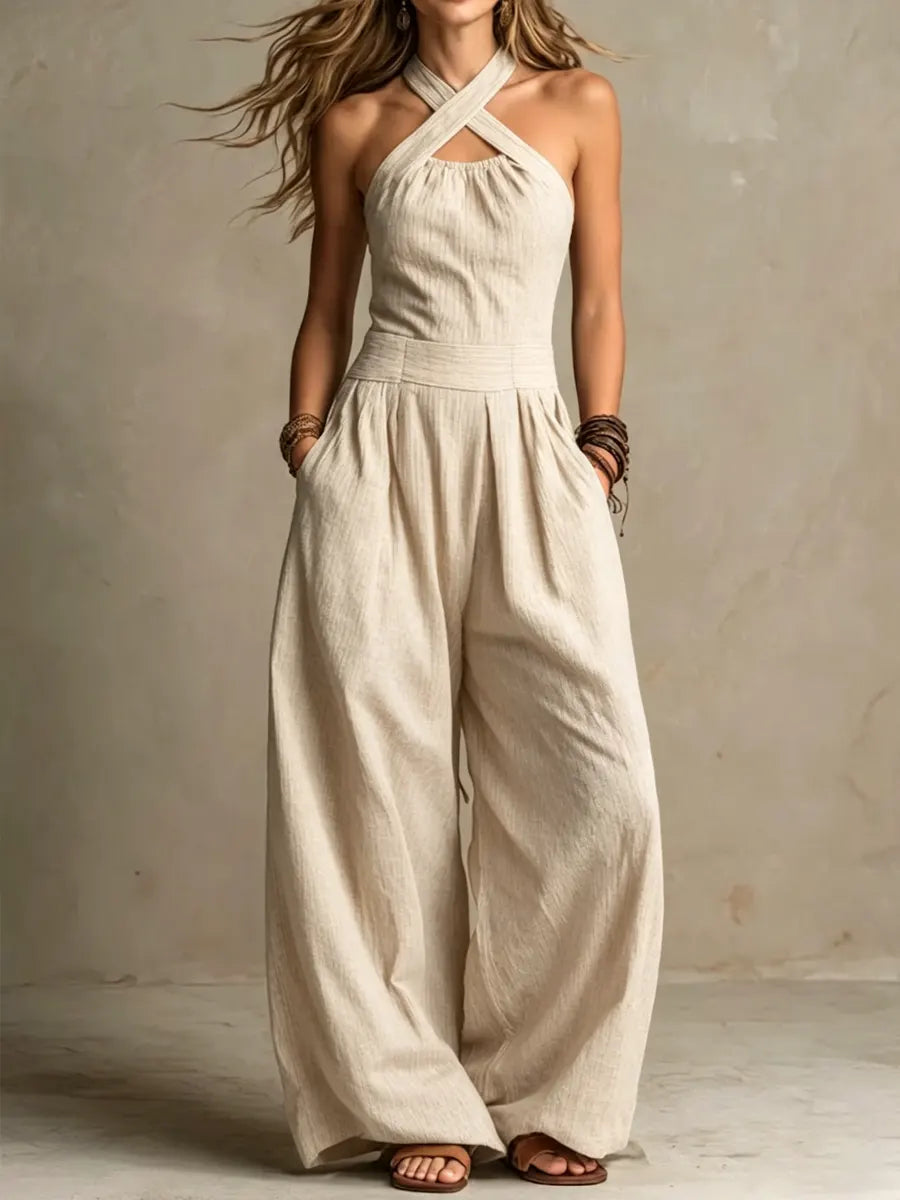 Combinaison élégante Bianca de Danoir Paris en lin et coton noir avec décolleté croisé, ajustée et sophistiquée.