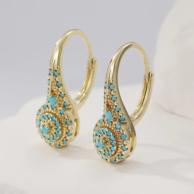 Boucles d'oreilles Danoir Paris Gilded Turquoise Bloom avec turquoise et finition dorée, style élégant et féminin.