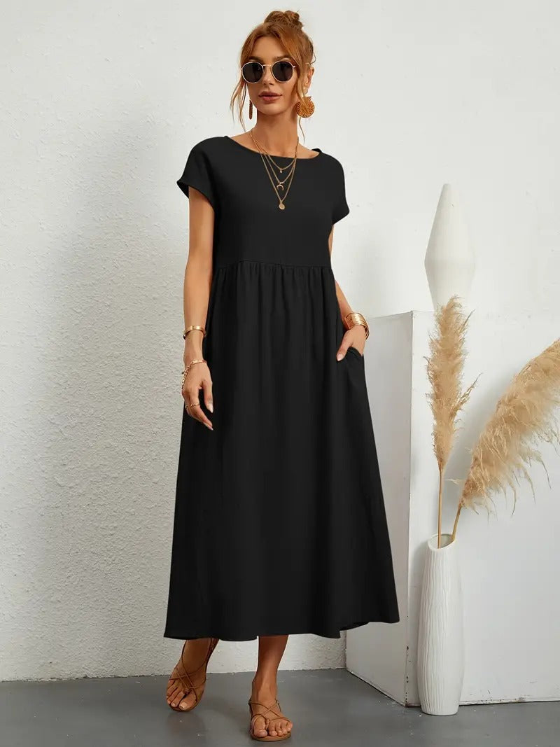Robe douce et élégante Jeane de Danoir Paris en vert, tissu fluide et design féminin visible sur l'image.