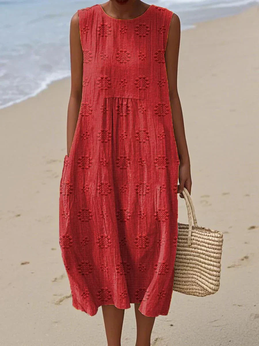 Robe d'été élégante Rose de la marque Danoir Paris, tissu léger avec détails floraux et coupe fluide visible sur l'image.