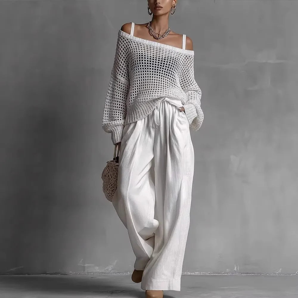 Ensemble deux pièces Claribel™ élégant de Danoir Paris, haut et pantalon en tissu fluide, couleur noire, porté par un mannequin.