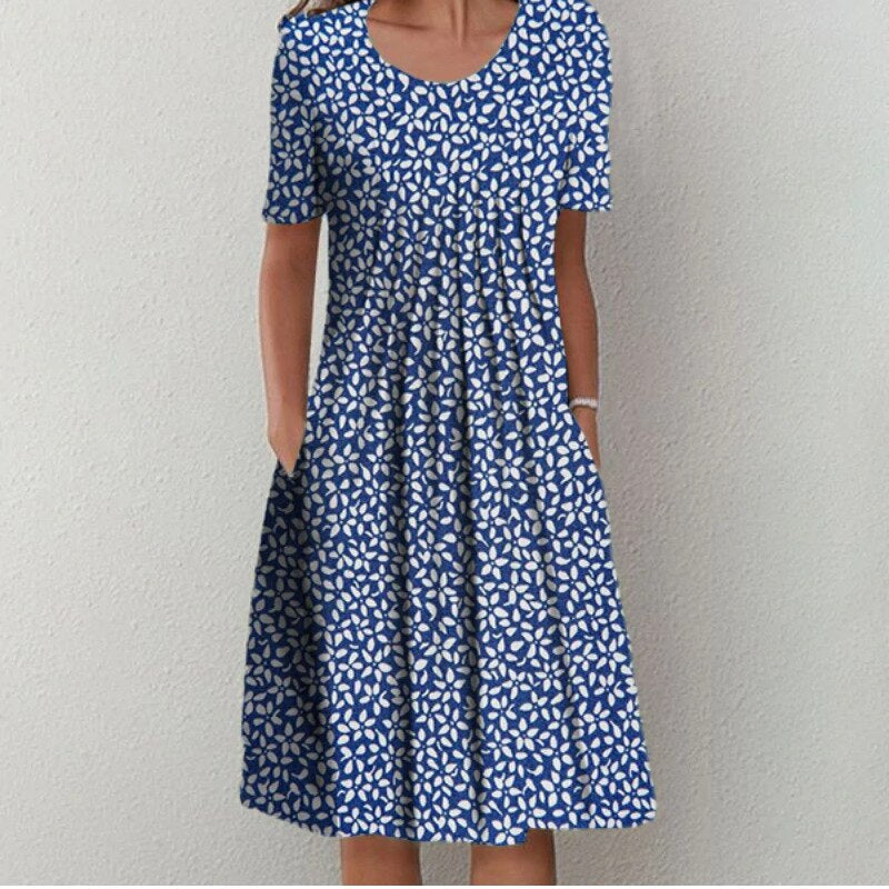 Robe midi élégante et aérienne pour femme de la marque Danoir Paris, tissu fluide avec détails sophistiqués.