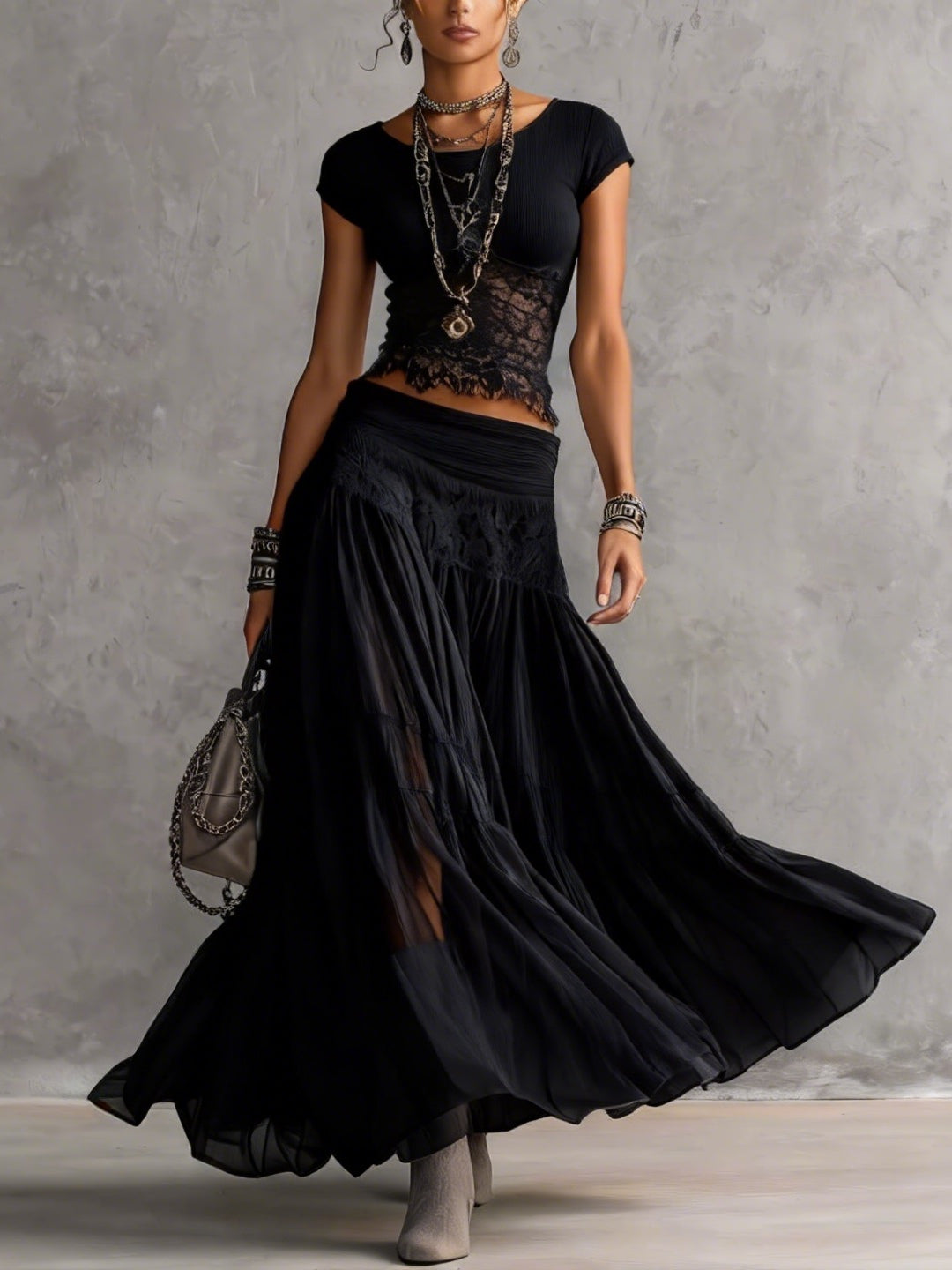 Ensemble top transparent en dentelle et jupe longue plissée noirs