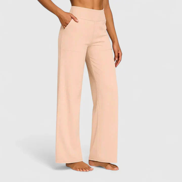 Pantalons élégants Danoir Paris Ame en tissu abricot avec coupe slim, vue de face.