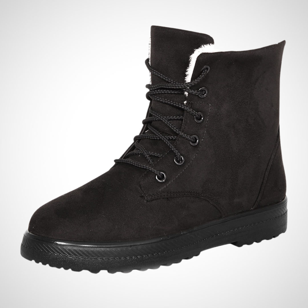 Bottines d'hiver à lacets Émeline par Danoir Paris, en cuir marron avec semelle robuste, portées par une femme.