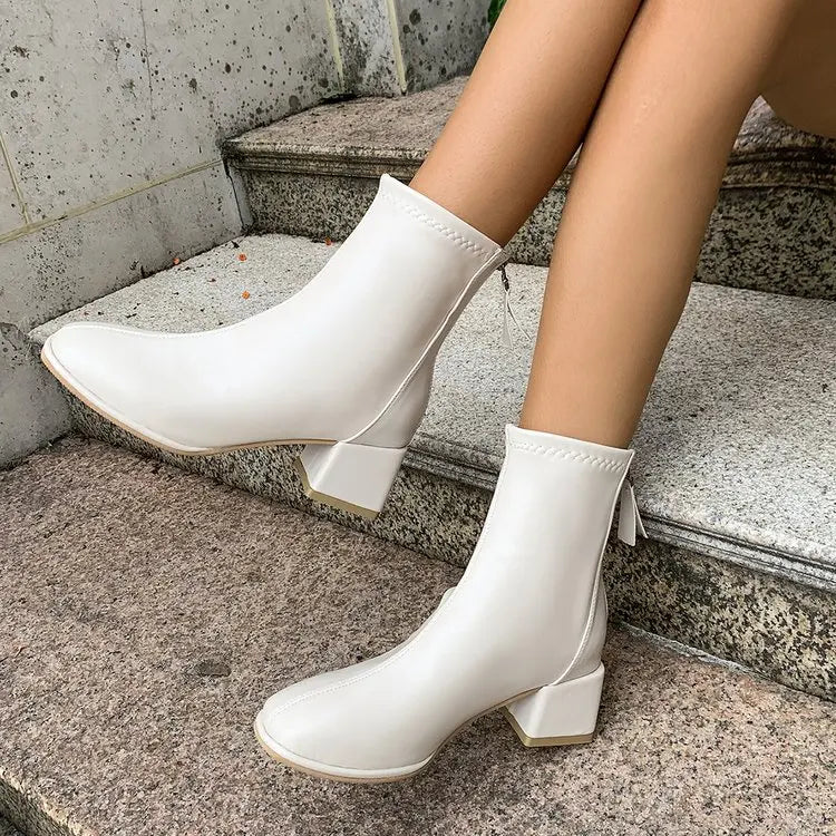 Bottines à talon bloc Danoir Paris Victoire avec zip arrière, en cuir noir, style élégant et moderne pour femme.