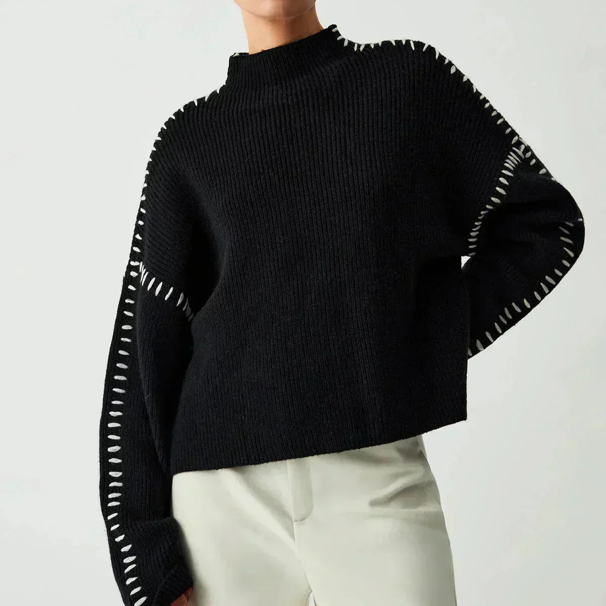 Pull Danoir Paris Nia en laine côtelée à col montant noir, style automne, confortable et tendance.