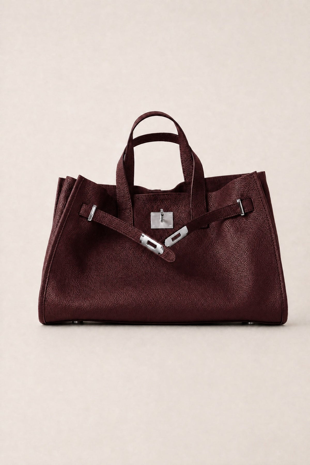 Sac Tote Meridian Danoir Paris de couleur bordeaux avec poches latérales et poignées en cuir.