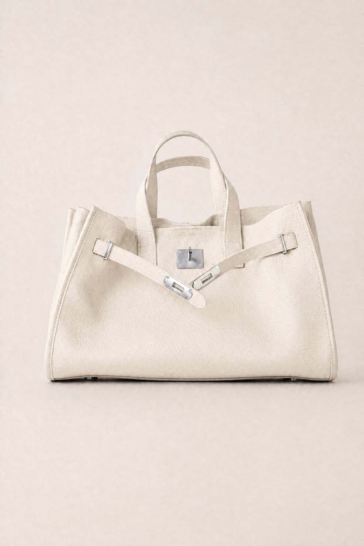 Sac tote Meridian Danoir Paris couleur crème avec poignées en cuir et design élégant posé sur une surface claire.