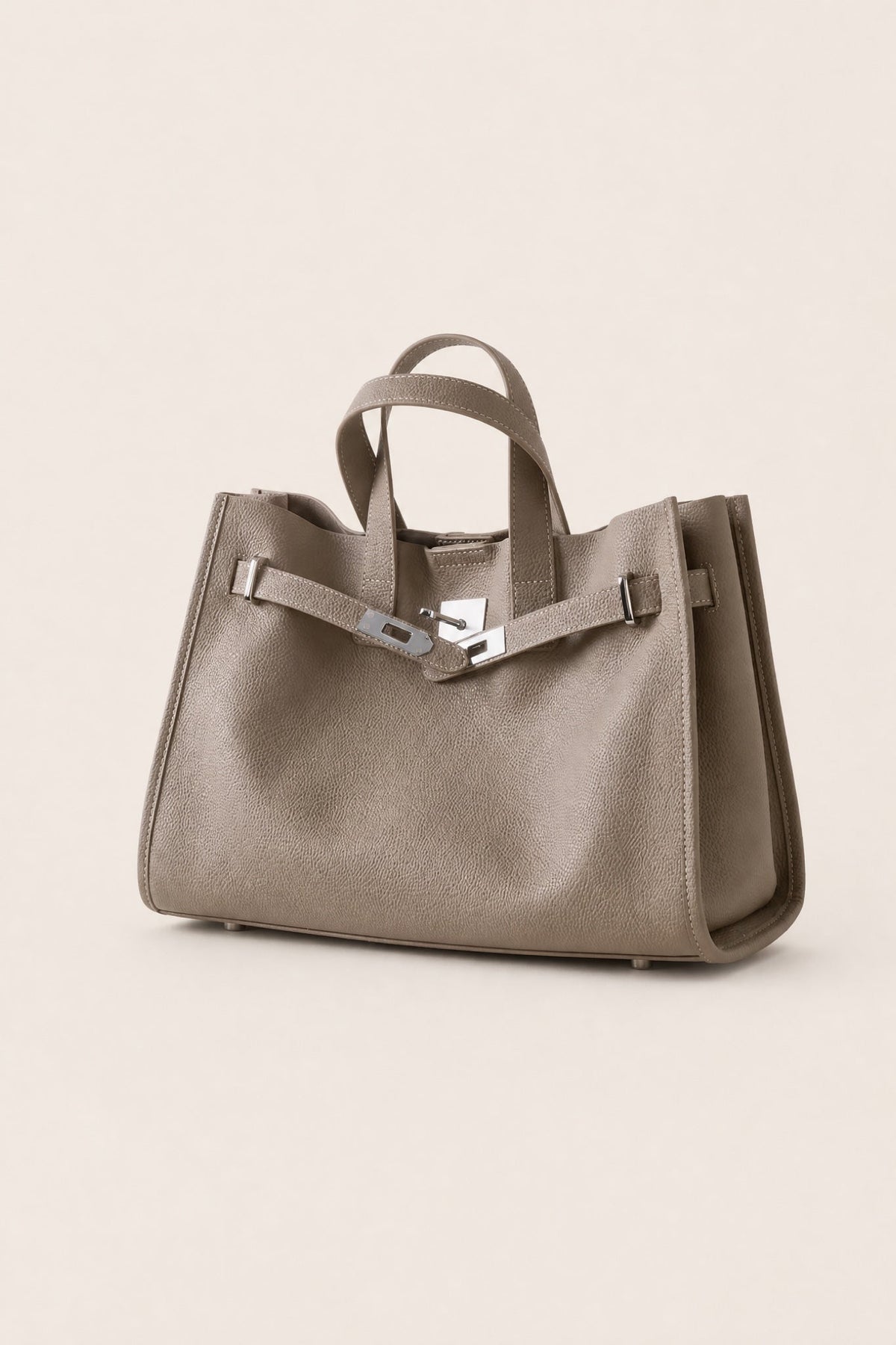Sac Tote Meridian de Danoir Paris en taupe, avec poignées en cuir et design élégant, visible en gros plan.