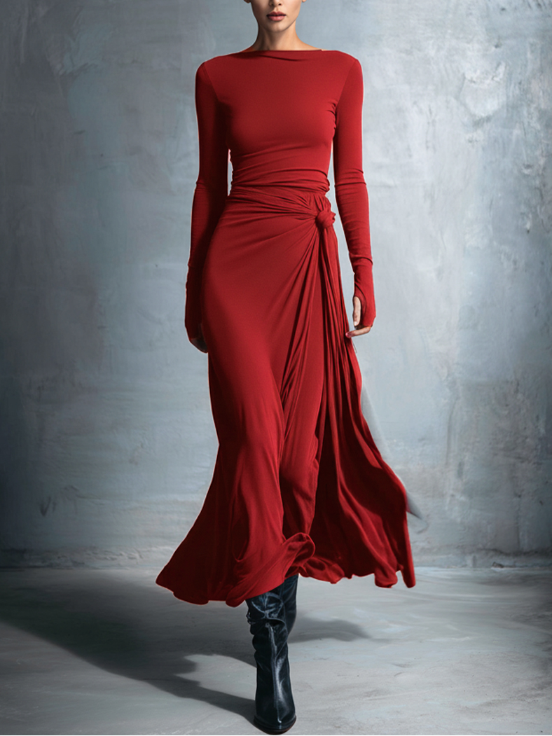 Robe maxi Naomie Danoir Paris avec nœud latéral, tissu fluide, couleur neutre, portée élégante pour occasions spéciales.