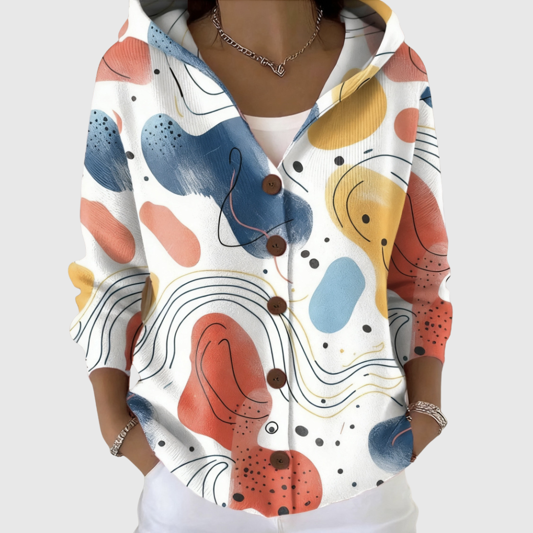 Cardigan confort à capuche en maille Danoir Paris, doux et chaud, porté en mode décontracté avec une coupe ample.