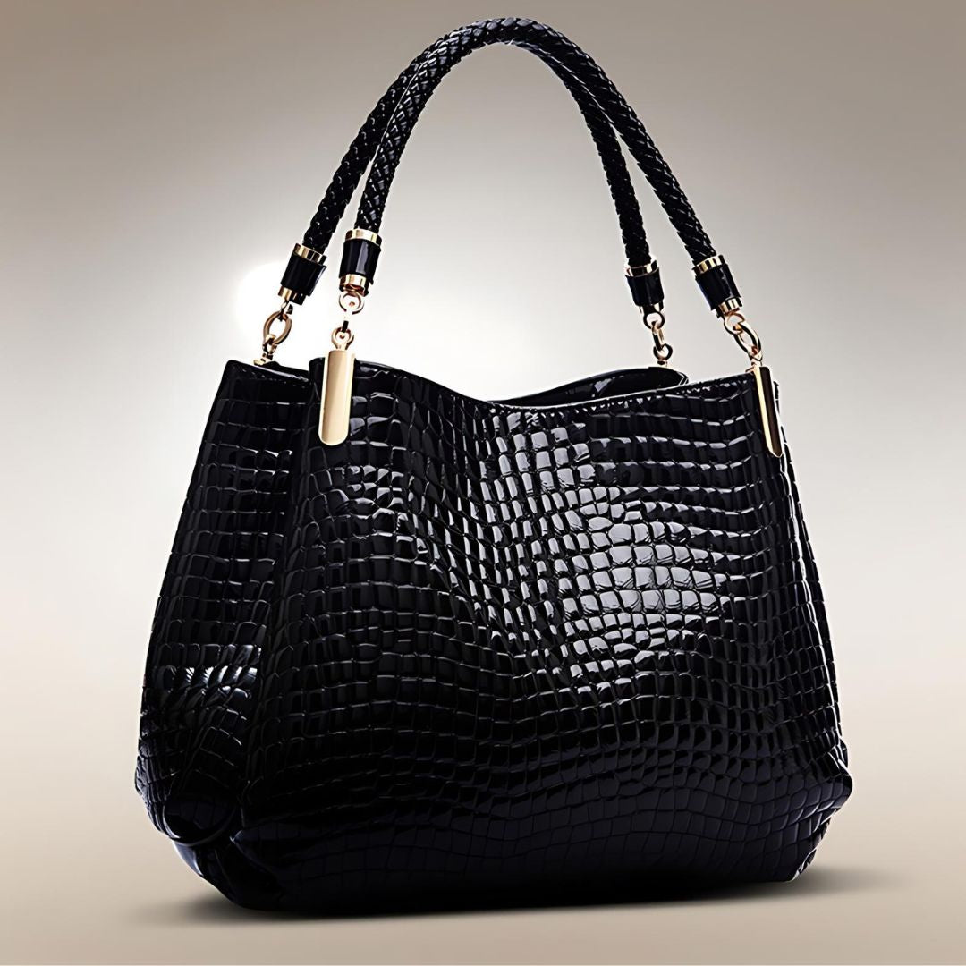 Sac à main en crocodile Lusso Milano de Danoir Paris, élégant et texturé, avec poignées en cuir et fermeture métallique visible.