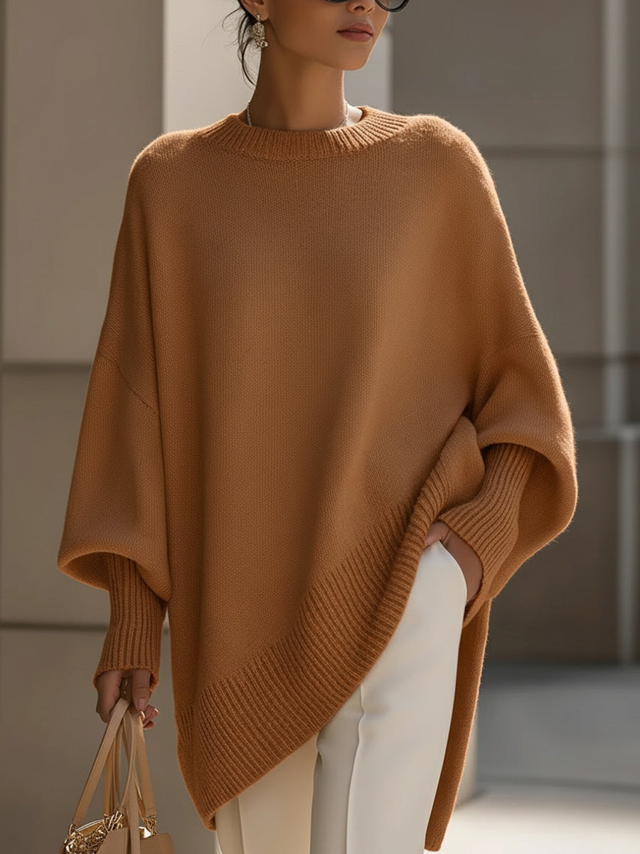 Pull oversize femme Jeanne de Danoir Paris, coupe fluide, en maille douce, porté de côté montrant le style décontracté et confortable.