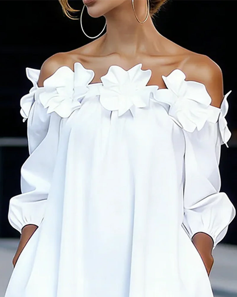 Robe à bretelles dénudées Danoir Paris Rhoda avec appliqué floral, tissu léger et détails élégants visible sur l'image.