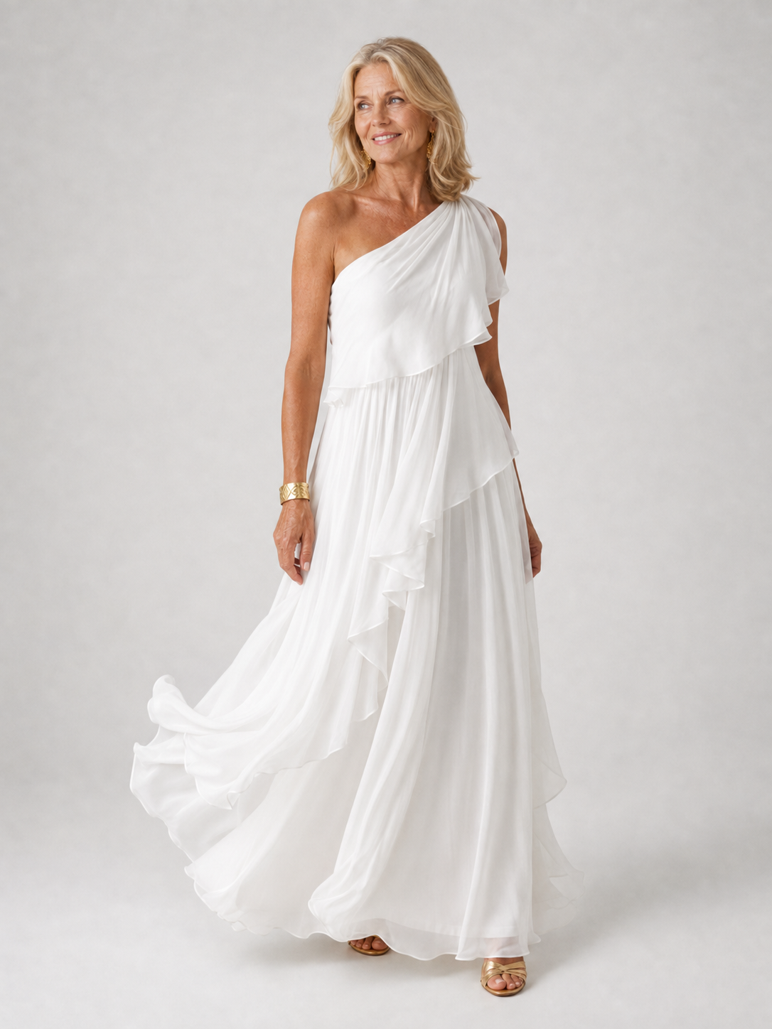 Robe longue femme monospalle avec volants Danoir Paris, style élégant, tissu fluide et détails féminins visibles sur l'image.