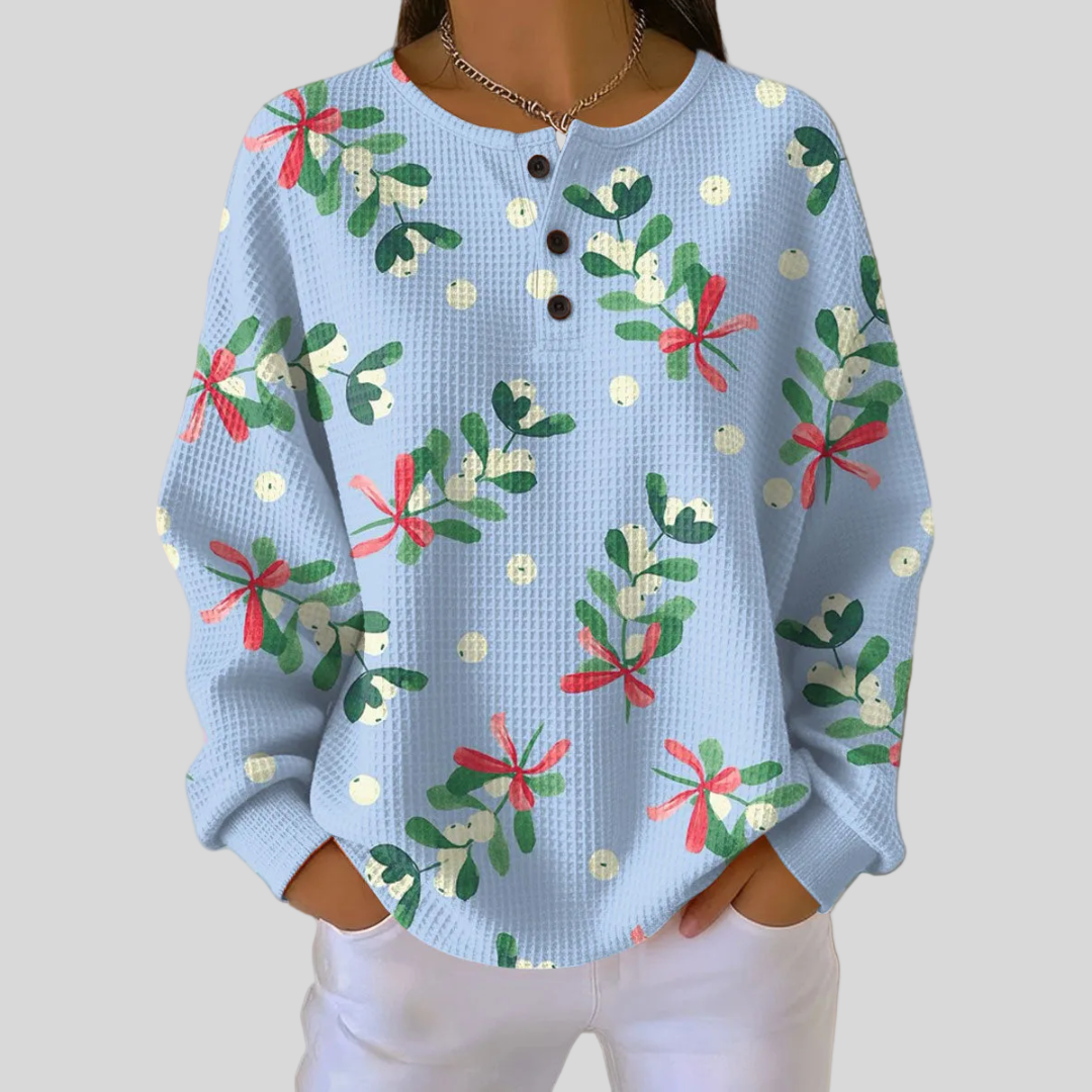 Sweat-shirt de Noël Danoir Paris Marlow avec motif de gui, doux et confortable, porté sur un mannequin.