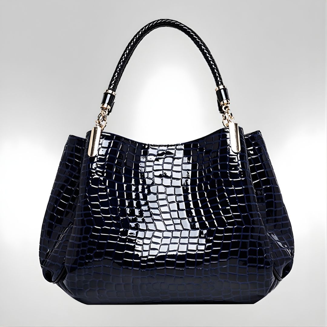 Sac à main en crocodile Lusso Milano de Danoir Paris, élégant et sophistiqué, avec finition en cuir crocodile brun.