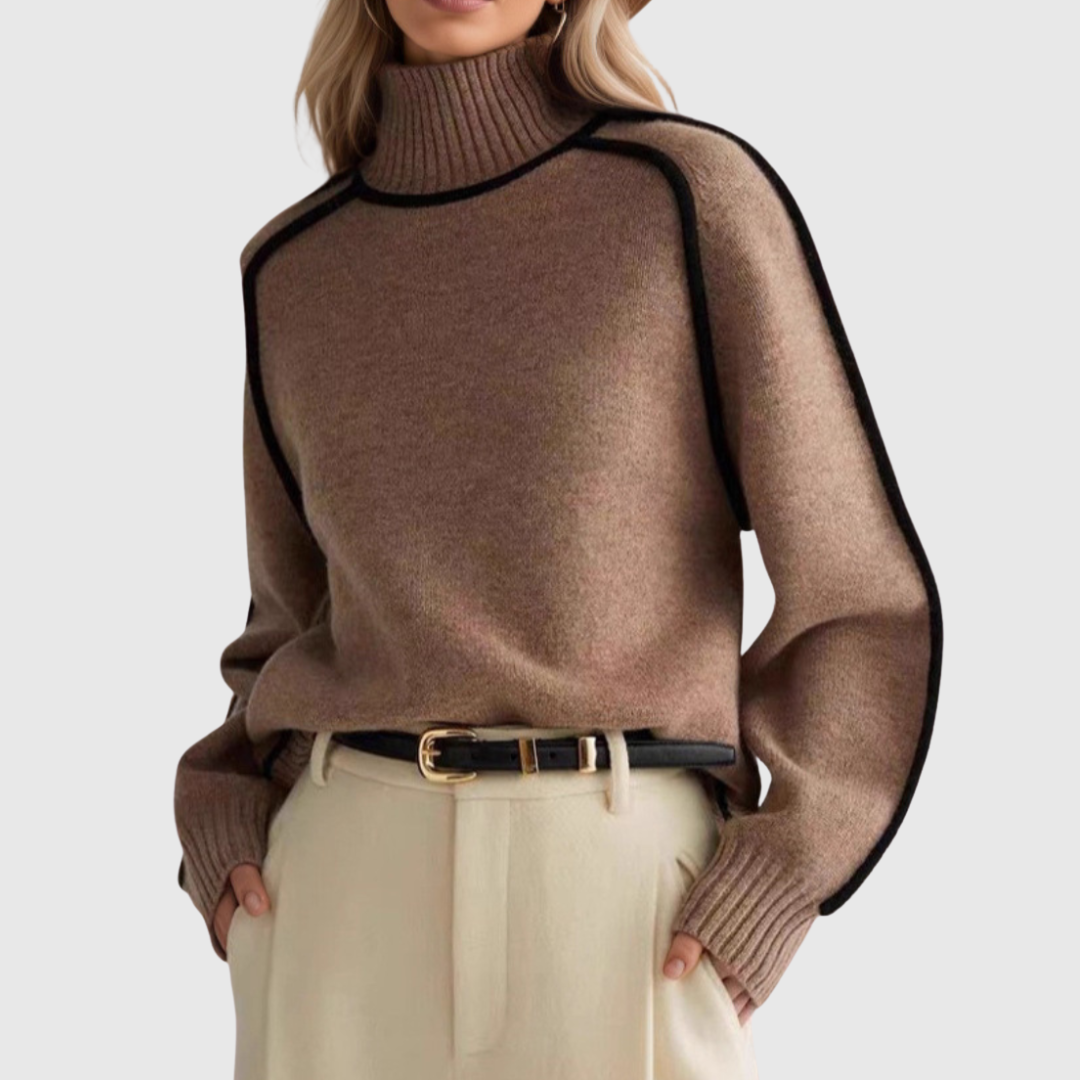 Pull élégant à col haut Donna Danoir Paris pour l'automne, en tissu chaud et confortable, porté par une mannequin.