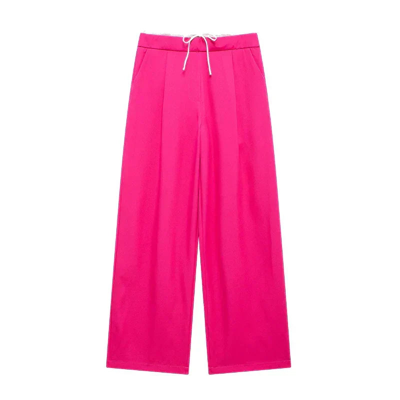 Pantalon Manon de Danoir Paris, en tissu léger, vue de face avec ceinture élégante et coupe ajustée.