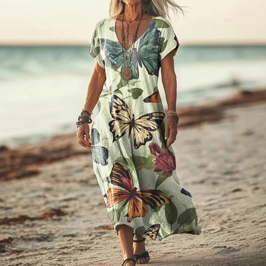 Isola - Robe longue à imprimés naturels et coupe aérienne
