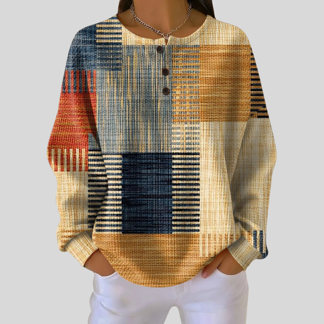 Haut à col boutonné à motifs Danoir Paris Mavis, en tissu léger, avec motifs floraux et manches longues.
