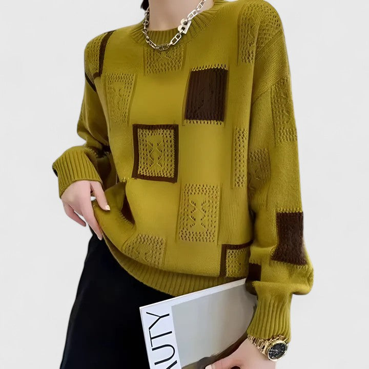 Pull sophistiqué Danoir Paris en laine beige, détail côtelé et coupe élégante visible dans l'image.