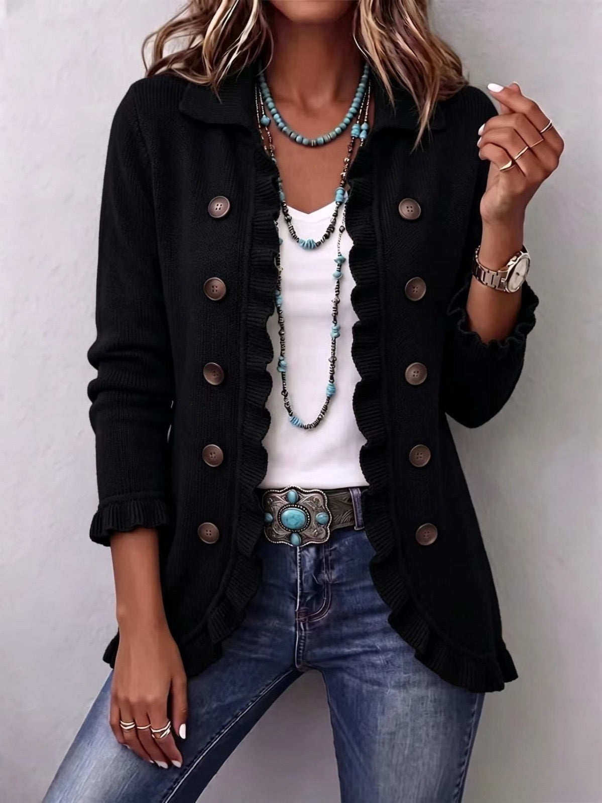 Veste en maille côtelée noire avec volants, Zélie, par Danoir Paris, détails en tissu côtelé et style élégant.