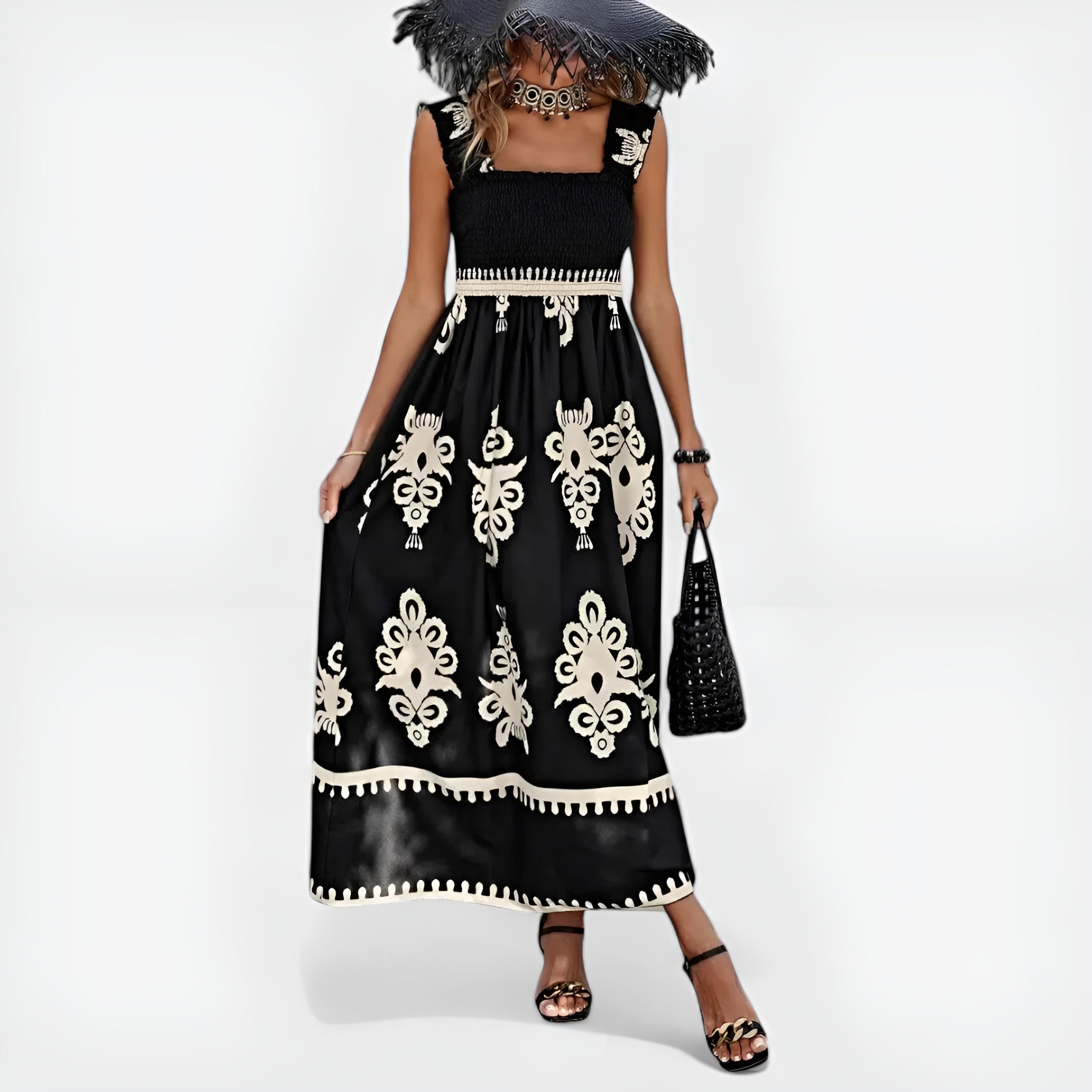Robe d'été Magda de Danoir Paris, style unique, en tissu léger avec motifs floraux, portée sur mannequin blanc.