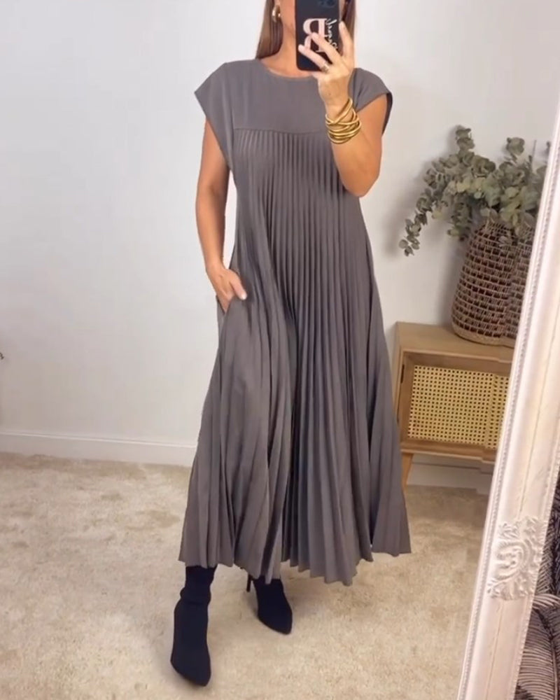 Robe longue élégante Sylvie de Danoir Paris en beige, vue de face, tissu fluide et coupe sophistiquée.