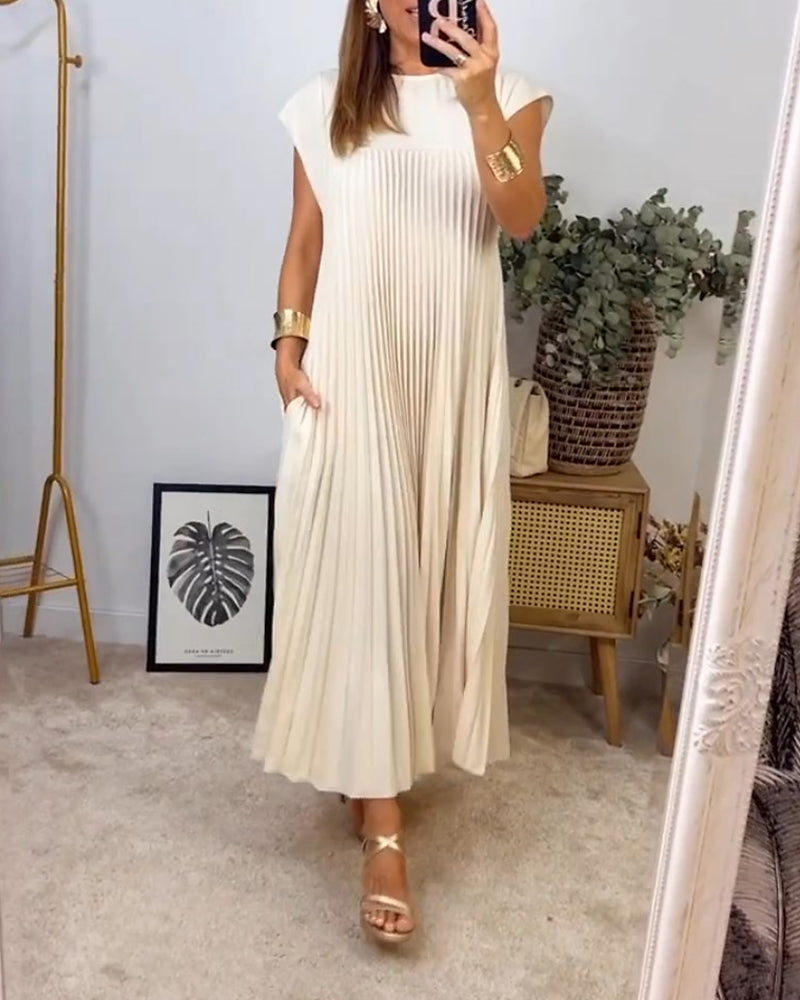 Robe longue élégante beige Sylvie de Danoir Paris, vue de face avec détails de la couture et du tissu fluide.