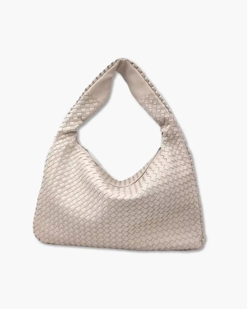 Sac à main The London de Danoir Paris avec poignée en cuir et détails élégants, vue de face sur fond neutre.