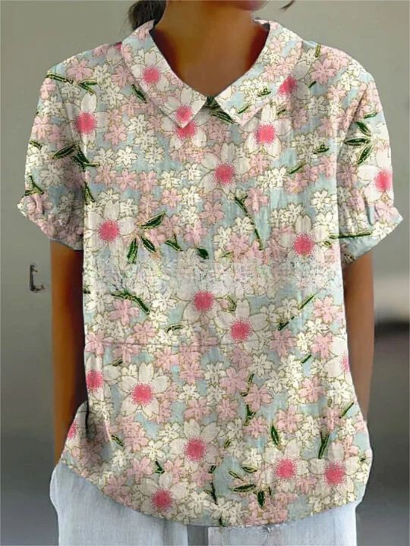 Chemise fleurie élégante Sofia de Danoir Paris, tissu léger avec motif floral coloré, parfait pour un style chic et féminin.