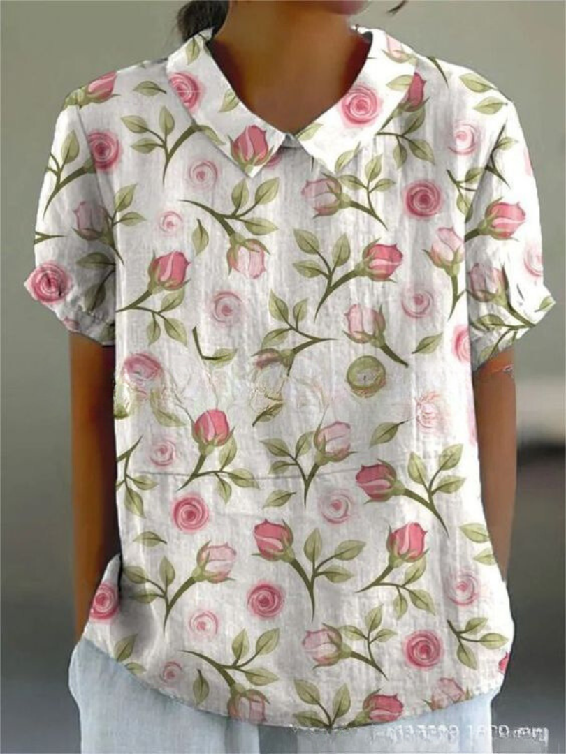 Chemise fleurie élégante Sofia de Danoir Paris, tissu léger avec motifs floraux colorés, ajustée et tendance.