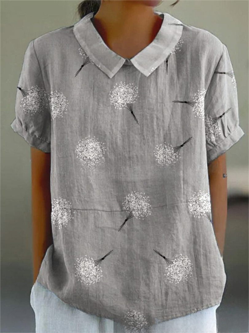 Chemise fleurie élégante Sofia de Danoir Paris, tissu léger avec motifs floraux colorés sur fond blanc.