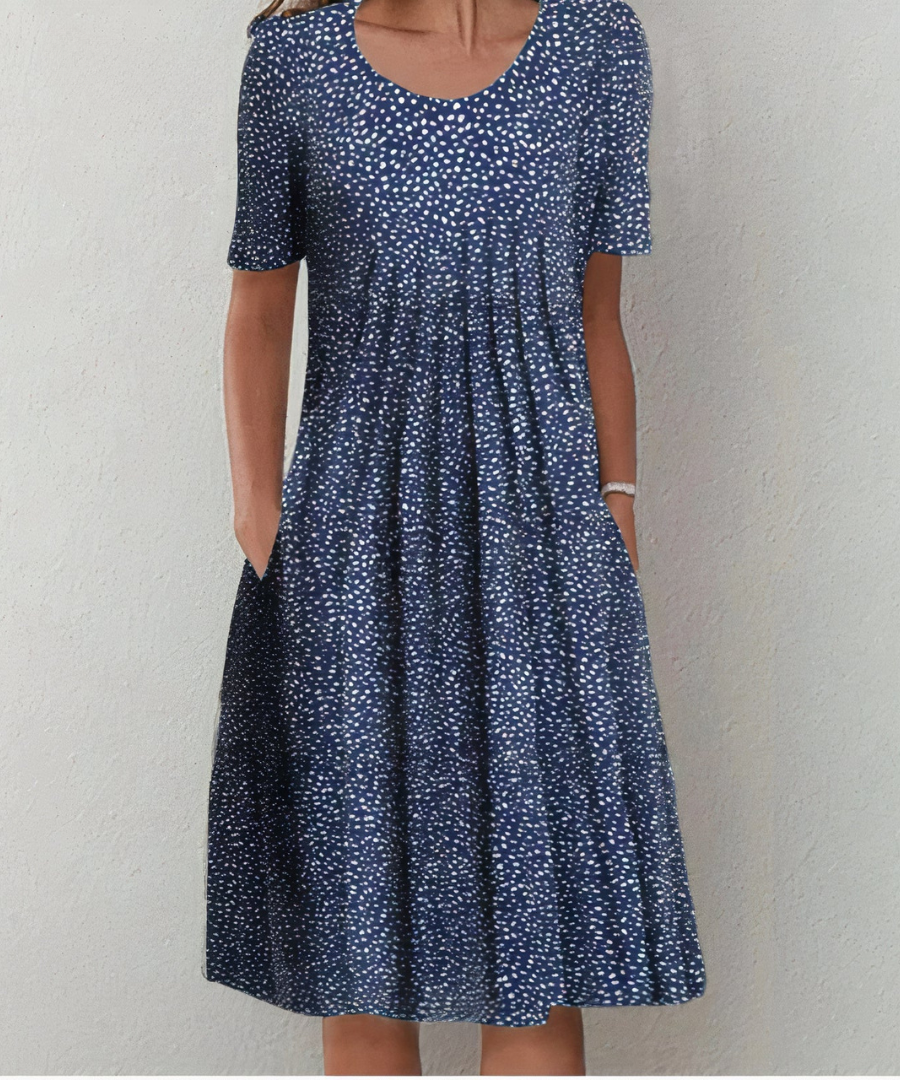 Robe florale élégante Danoir Paris en tissu léger avec motifs de clementine, coupe flatteuse pour femme.