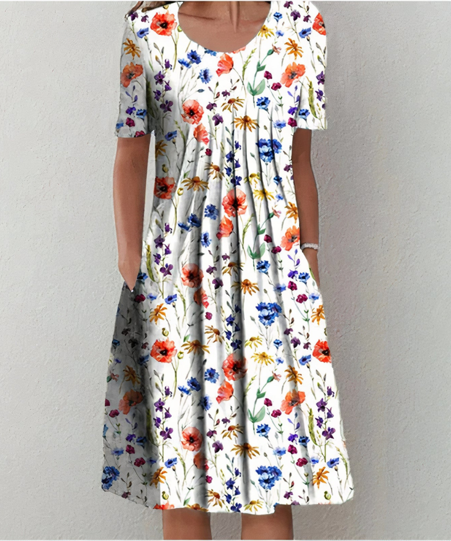 Robe florale élégante Danoir Paris pour femmes, motif coloré, coupe fluide et détails raffinés, parfaite pour l'été et les occasions spéciales.