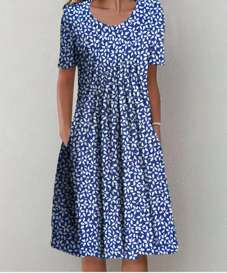 Robe florale élégante Danoir Paris, clementine, avec motifs colorés et coupe fluide, portée en image
