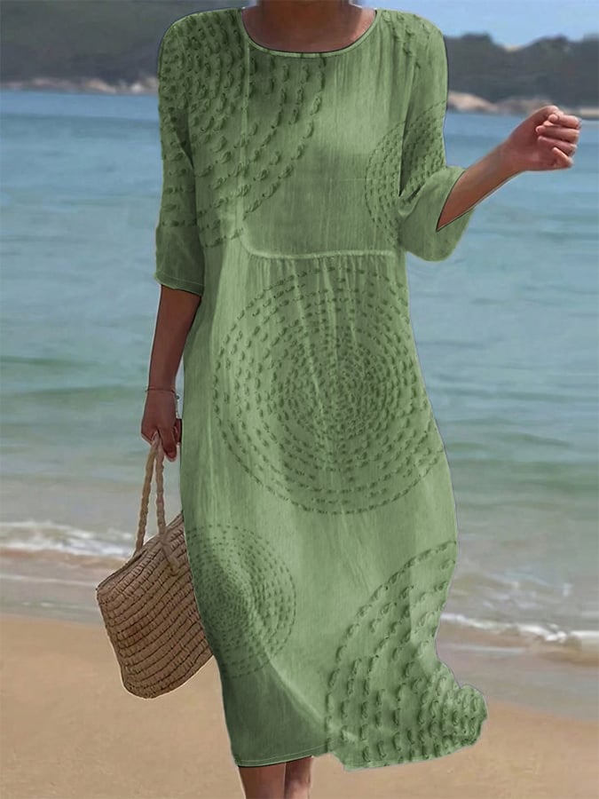 Robe midi élégante Améliane™ de Danoir Paris avec détails délicats, tissu fluide et finition sophistiquée visible sur l'image.