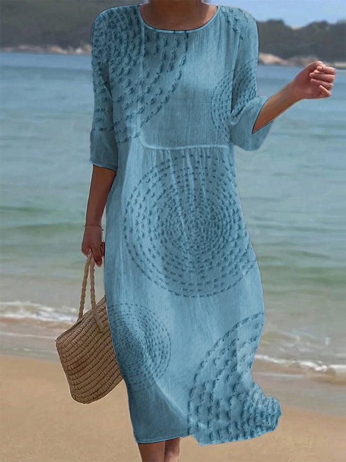 Robe midi élégante Améliane™ de Danoir Paris avec détails délicats, en tissu fluide et coupe sophistiquée.