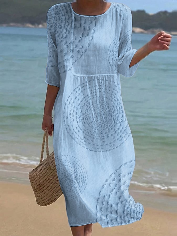 Robe midi élégante Améliane™ de Danoir Paris avec détails délicats, tissu fluide et coupe sophistiquée visible sur l'image.