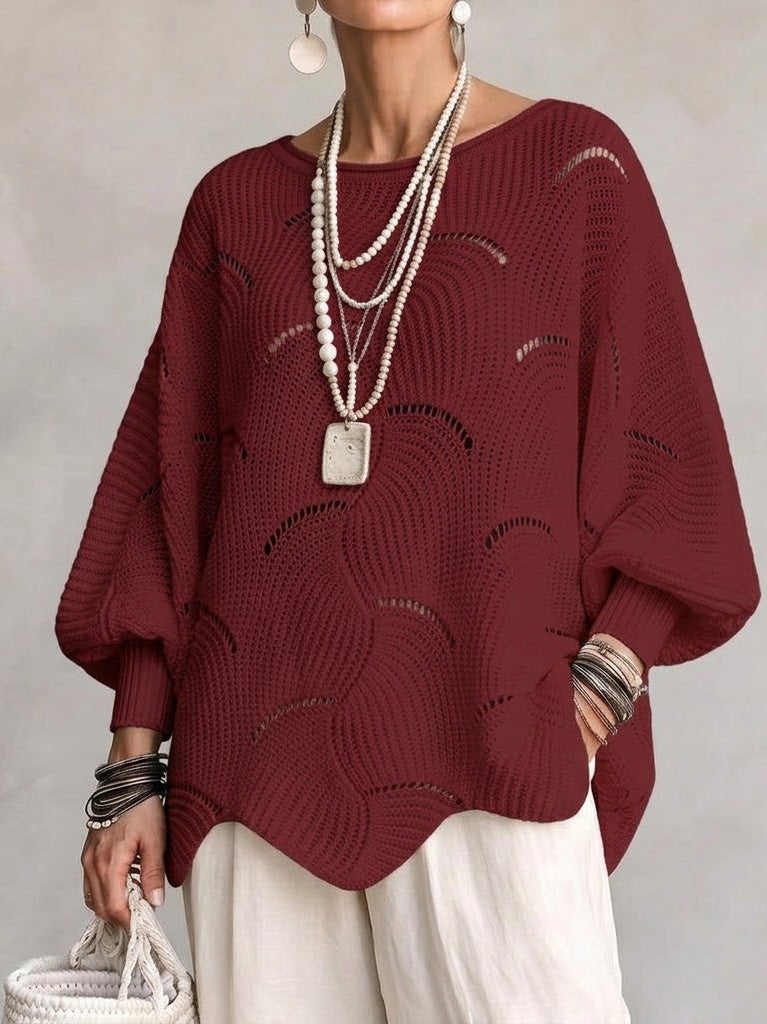 Haut en tricot blanc Danoir Paris avec manches lanternes amples et motif en vagues creuses, vue de face.
