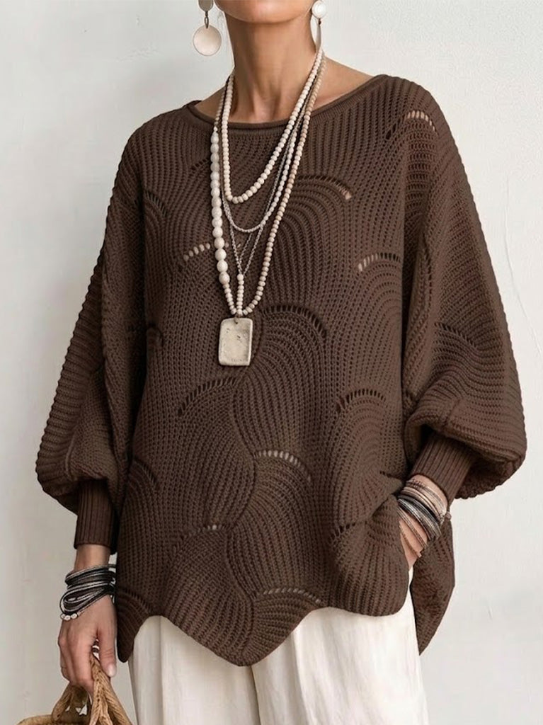 Haut en tricot blanc Danoir Paris avec manches lanternes amples et motif en vagues creuses, porté sur un mannequin.
