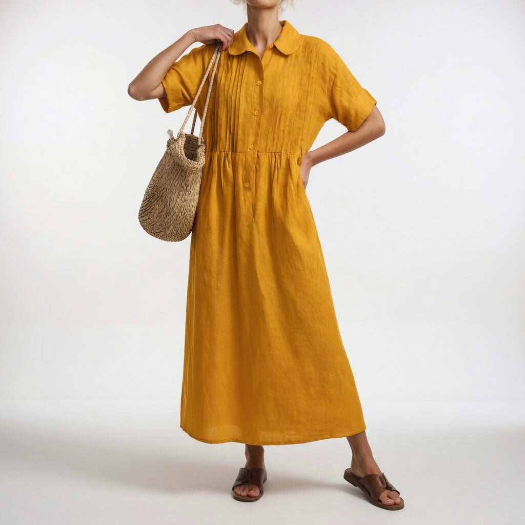 Robe chemise fluide estivale Lysandra™ de Danoir Paris en tissu léger blanc, parfaite pour l'été et les journées ensoleillées.