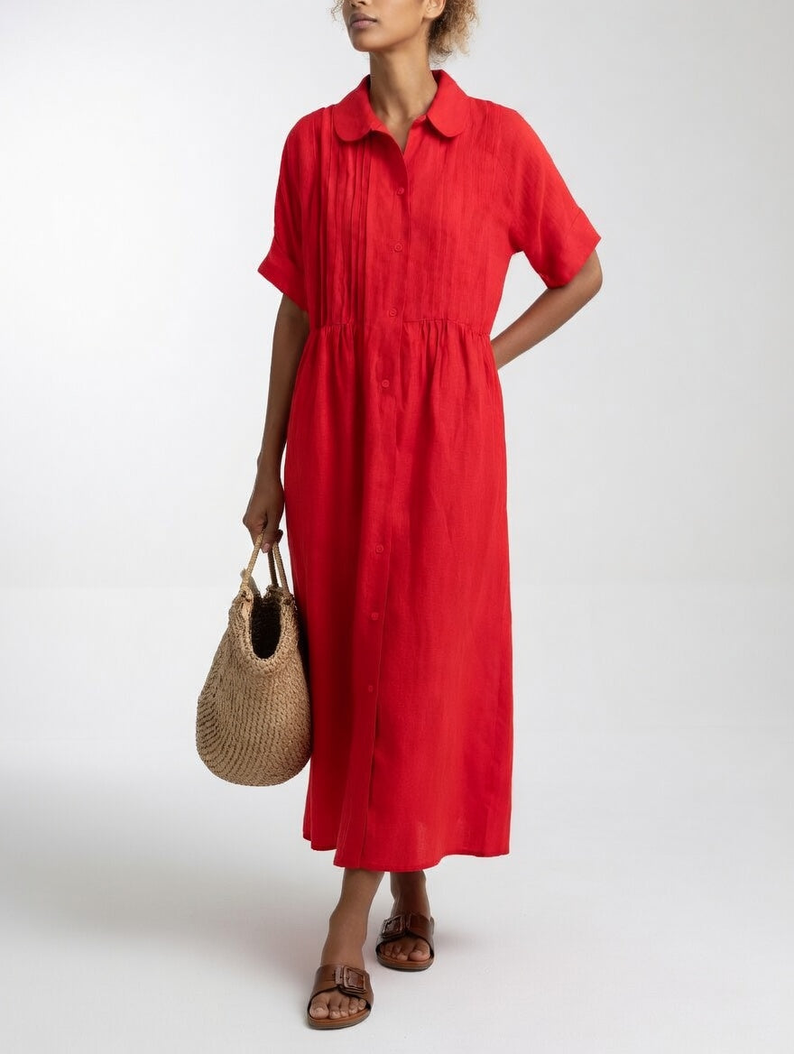 Robe chemise fluide estivale Lysandra™ de Danoir Paris, tissu léger blanc avec détails élégants, idéale pour l'été.